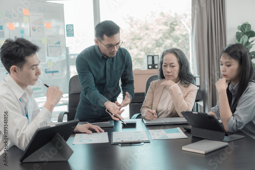Group of business colleagues meeting in conference room Versatile modern office: leading business meetings with managers, talking, using graph presentations big data digital entrepreneur