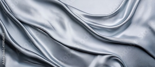 Elegant Silver Silk Fabric with Fluid Textured Waves and Subtle Gradient Shades Ideal for Text Overlay in Clean Minimalist Style photo