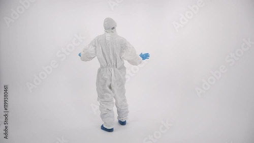 A scientist in PPE showing a 'no access' sign on a white background 