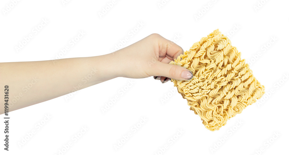 raw instant noodles, in hand, outstretched hand with noodle briquette isolated from background raw instant noodles, in hand, outstretched hand with noodle briquette isolated from background