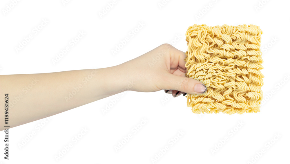 raw instant noodles, in hand, outstretched hand with noodle briquette isolated from background raw instant noodles, in hand, outstretched hand with noodle briquette isolated from background