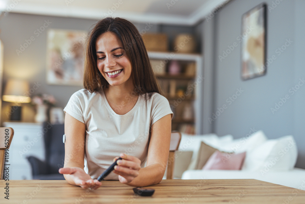 Smiling Woman Checking Blood Sugar Level At Home With Glucometer Smiling Woman Checking Blood Sugar Level At Home With Glucometer