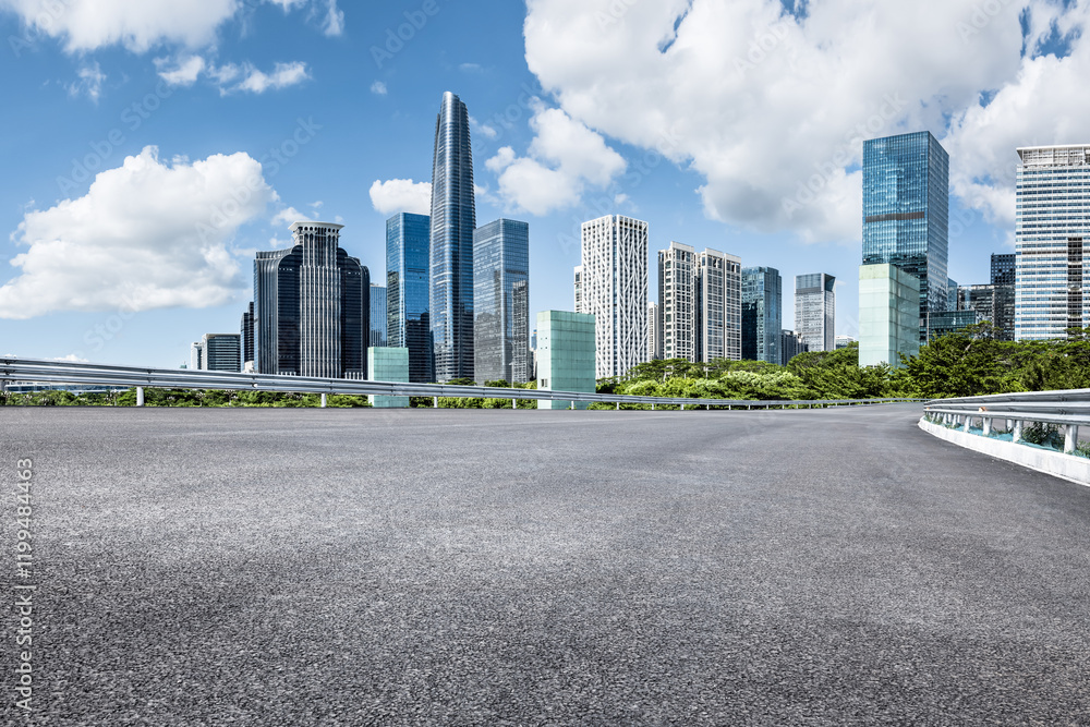 Empty asphalt road and modern city skyline with blue sky background Empty asphalt road and modern city skyline with blue sky background