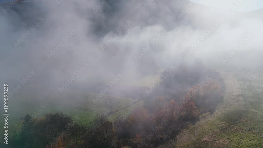 Fog in the autumn landscape around the Gallego River. Aerial view from a drone. Municipality of Sabiñáñigo. Alto Gallego region. Huesca. Aragon. Spain. Europe. Fog in the autumn landscape around the Gallego River. Aerial view from a drone. Municipality of Sabiñáñigo. Alto Gallego region. Huesca. Aragon. Spain. Europe.