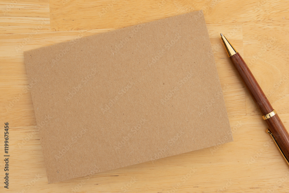 Blank greeting card with pen on wooden table Blank greeting card with pen on wooden table