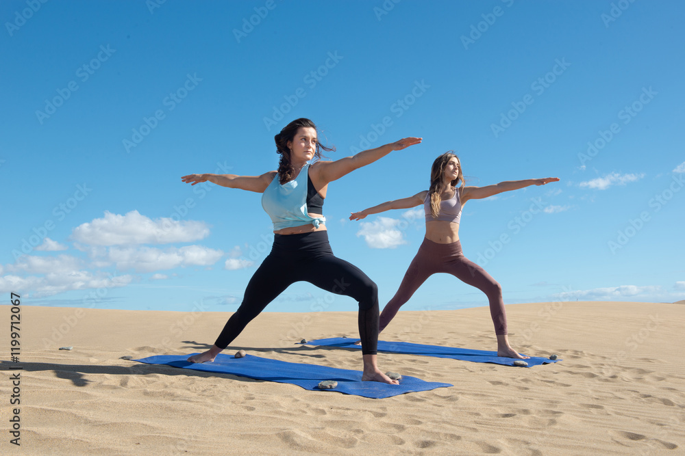 Obraz premium women in yoga or streching practisse at the beach