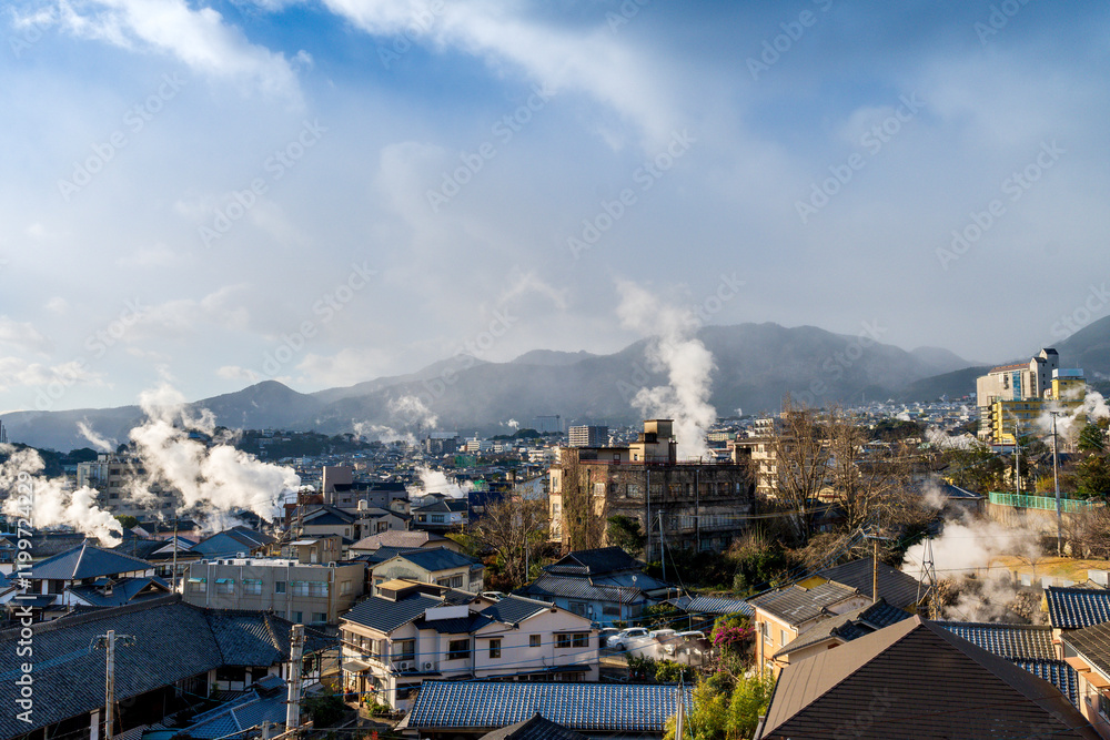 Beppu cityscape with Steam drifted from public hot spring baths and ryokan onsen background, Beppu, Oita, Kyushu, Japan.