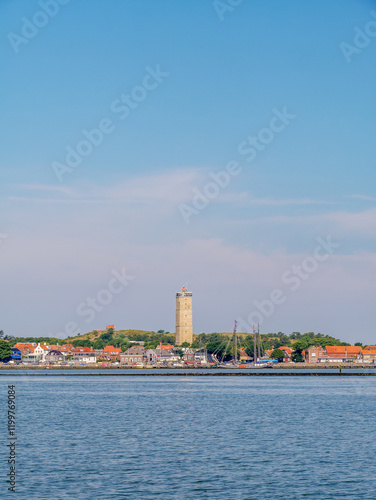 Skyline of West-Terschelling harbor and Brandaris lighthouse on West Frisian island Terschelling from Waddensea, Friesland, Netherlands