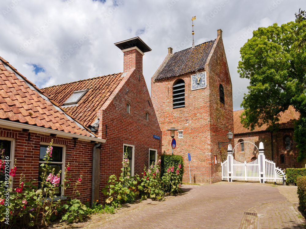 Streetscene with detached churchtower of Reformed Church in Ezinge, Westerkwartier, Groningen Streetscene with detached churchtower of Reformed Church in Ezinge, Westerkwartier, Groningen