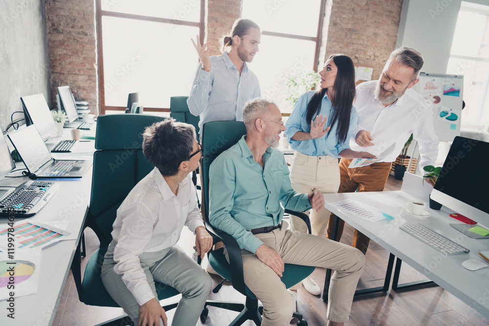 Photo of teamwork startup partners discussion paperwork comfortable nice creative startup office loft room interior Photo of teamwork startup partners discussion paperwork comfortable nice creative startup office loft room interior