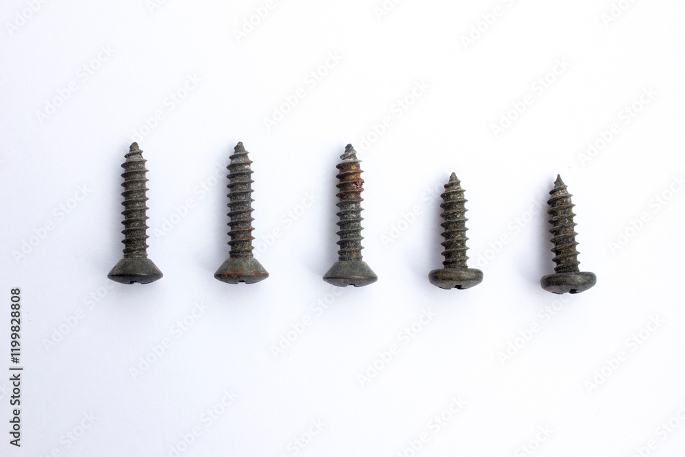 Black drywall screws isolated on white background. Black drywall screws isolated on white background.