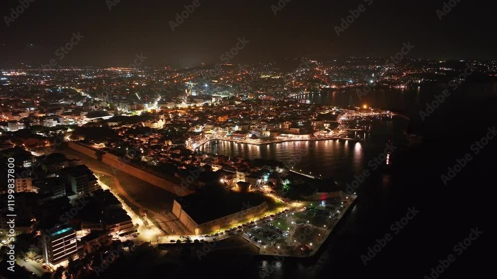 Chania town by night, Drone shot, Crete, Greece, Aerial view of Chania with the amazing lighthouse, Beautiful Old city, Greece and best scenic places - panorama of picturesque old town Chania town by night, Drone shot, Crete, Greece, Aerial view of Chania with the amazing lighthouse, Beautiful Old city, Greece and best scenic places - panorama of picturesque old town