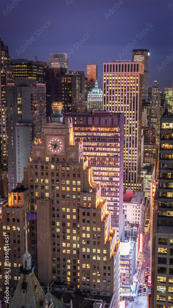 A nighttime view of Manhattan downtown in the New York City showcasing illuminated skyscrapers, set against a deep blue sky. A nighttime view of Manhattan downtown in the New York City showcasing illuminated skyscrapers, set against a deep blue sky.