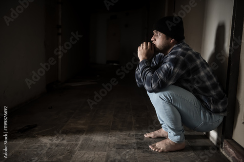 A junkie experiences drug hallucinations. With a look of terror and fear on his face photo