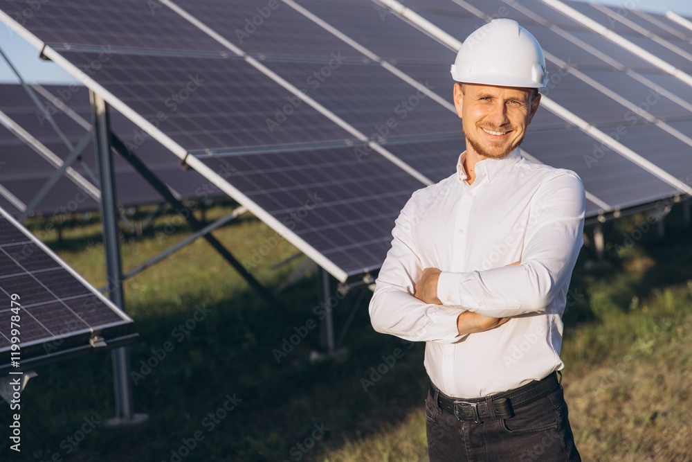 Confident Engineer with Solar Panels in Bright Sunshine Confident Engineer with Solar Panels in Bright Sunshine