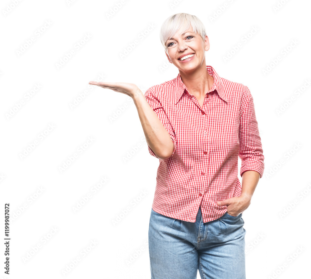 Obraz premium Woman holding free advertising space for your product on his palm, isolated on white background. Happy promoter middle aged woman, copy space for text.