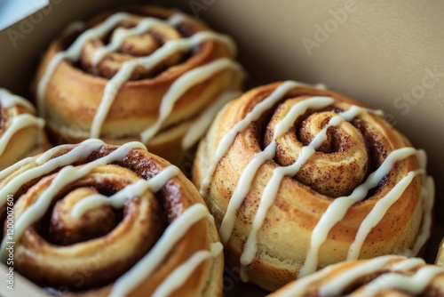 Delicious treats straight from the oven, topped with sweet icing for a tasty snack photo