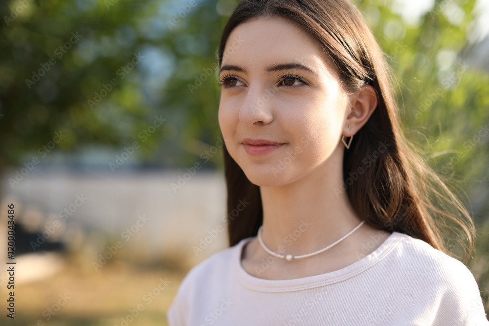 Portrait of beautiful teenage girl on city street. Space for text Portrait of beautiful teenage girl on city street. Space for text