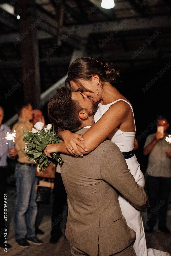 newlyweds at a wedding of sparklers