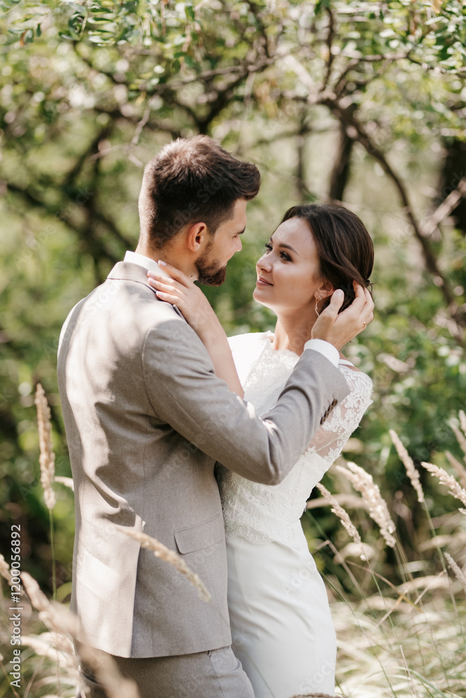 guy and a girl newlyweds are walking in the forest guy and a girl newlyweds are walking in the forest