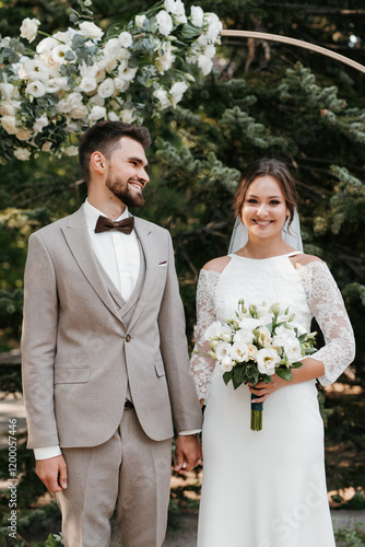 wedding ceremony of the newlyweds on the glade