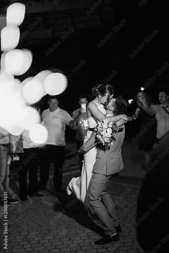 newlyweds at a wedding of sparklers
