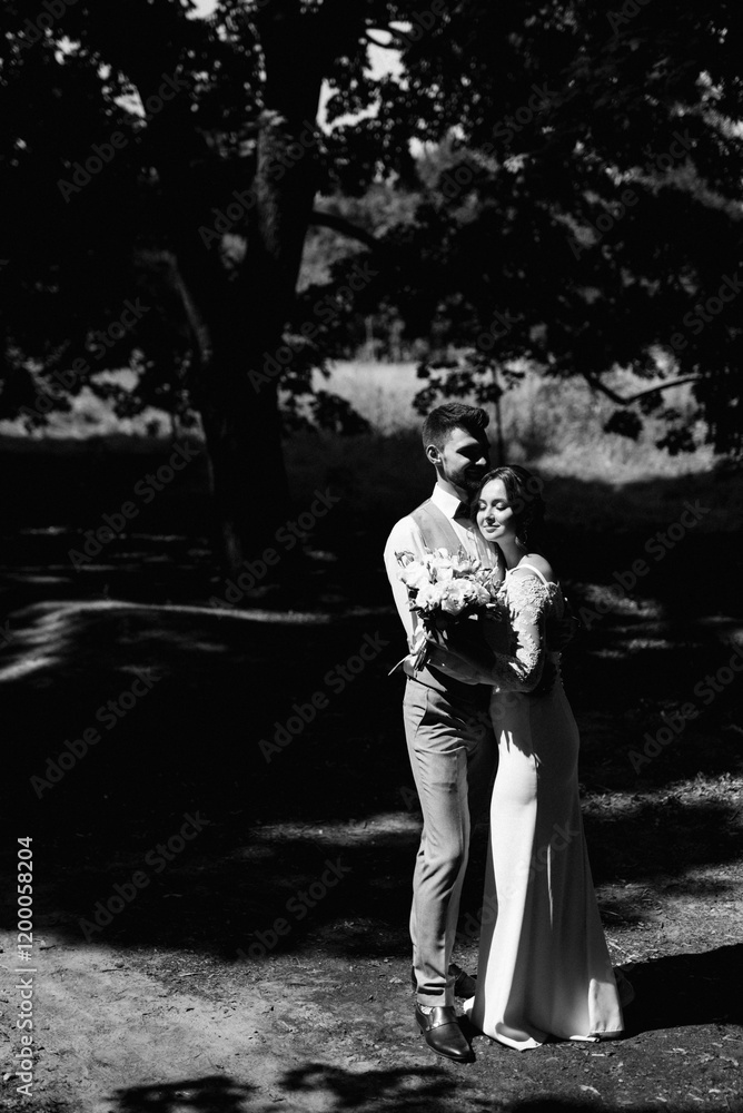 guy and a girl newlyweds are walking in the forest