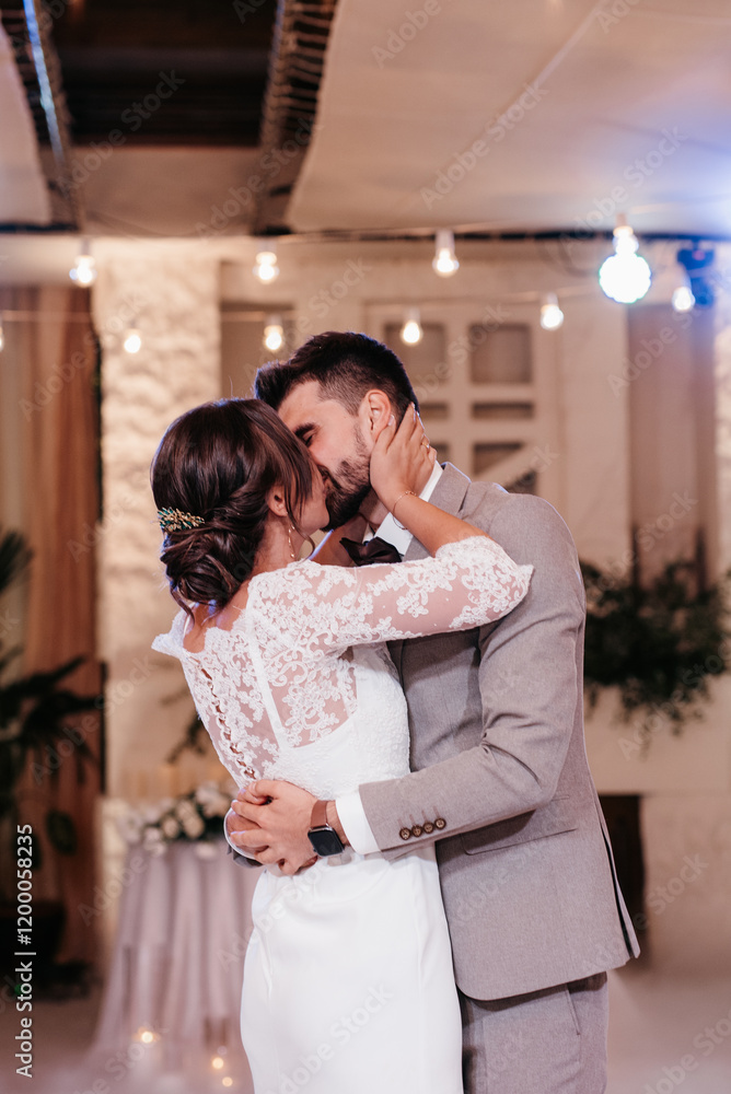 the first dance of the bride and groom inside a restaurant