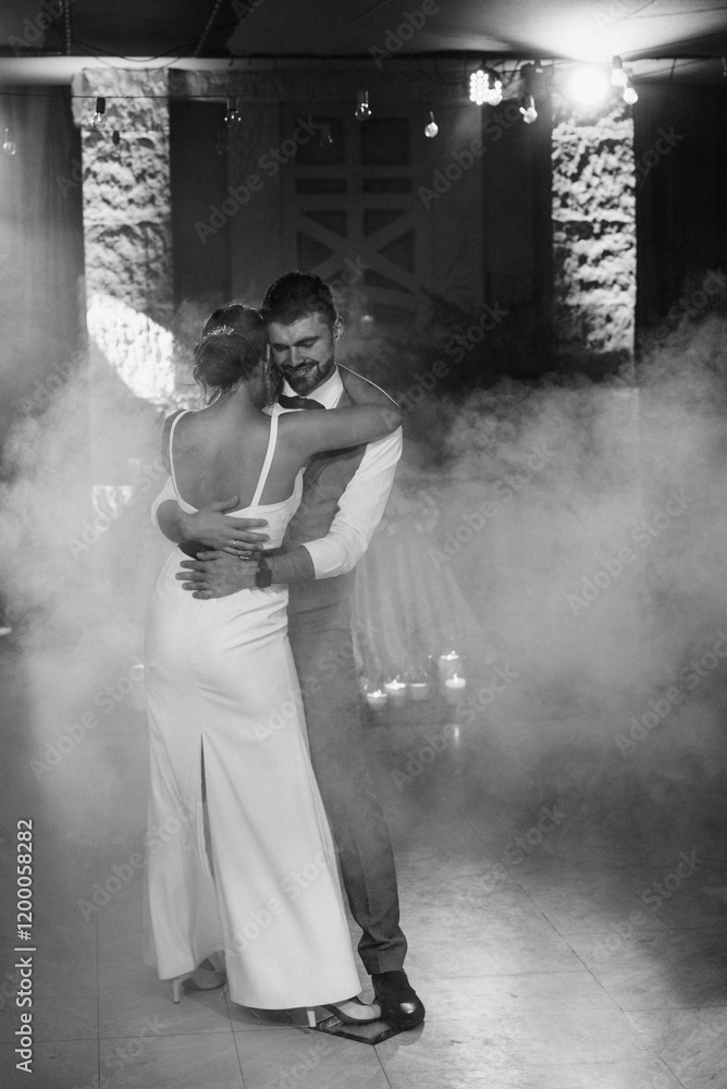 the first dance of the bride and groom inside a restaurant