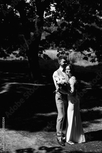 Obraz na płótnie guy and a girl newlyweds are walking in the forest w salonie