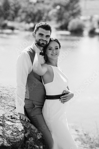 bride blonde girl and groom near the river