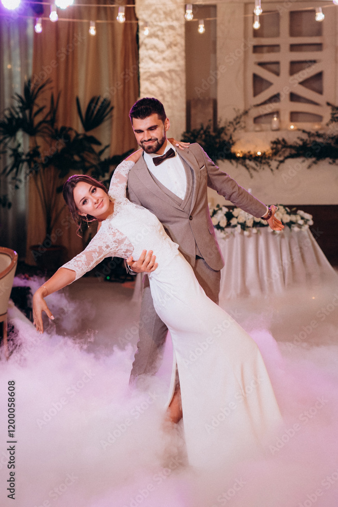 the first dance of the bride and groom inside a restaurant