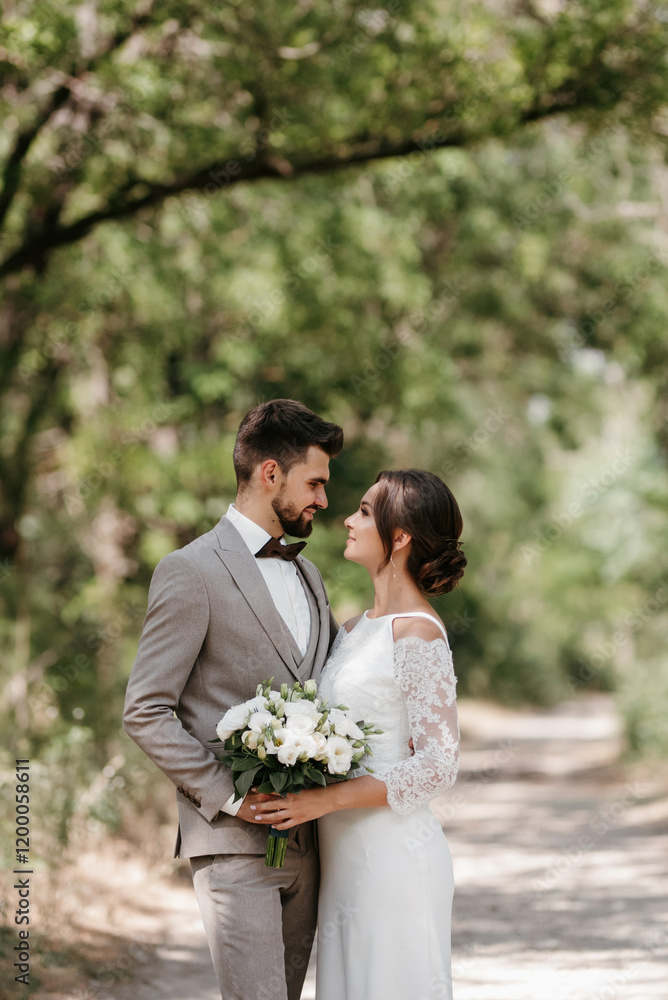 guy and a girl newlyweds are walking in the forest