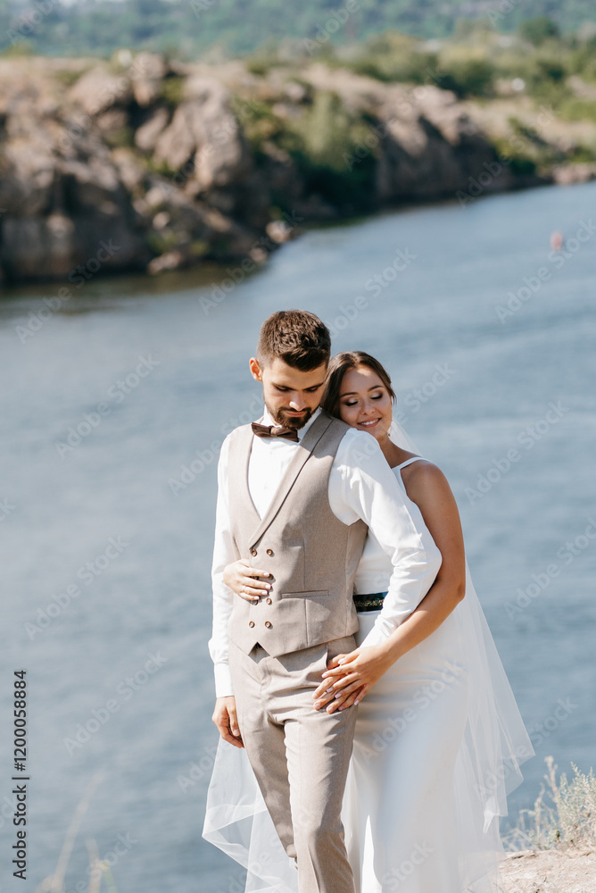 bride blonde girl and groom near the river