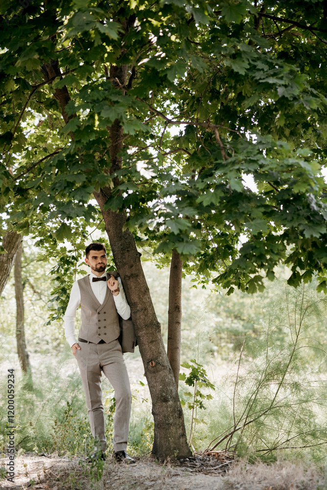 portrait of a guy in a gray three-piece suit