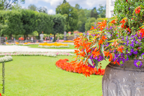 sunny day Salzburg city famous tourist garden with flowers castle Mirabella Austria