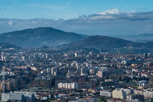 Vista parcial da encantadora cidade de Braga, capturada a partir do icônico Bom Jesus do Monte. A paisagem revela a harmonia entre a arquitetura urbana e o verde das colinas, destacando o charme histó photo