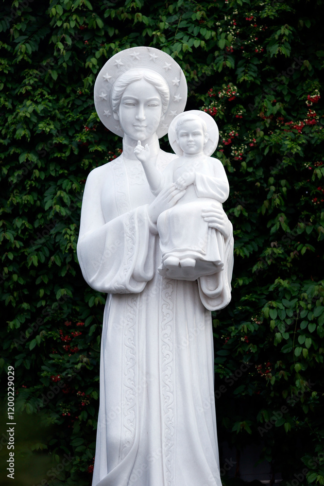 Tac Say Catholic Church. Statue of Our Lady of La Vang in Ao Dai dress Bac Lieu. Vietnam. . Tac Say Catholic Church. Statue of Our Lady of La Vang in Ao Dai dress Bac Lieu. Vietnam. .