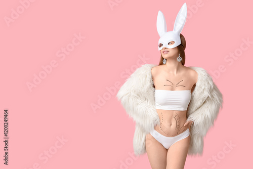 Young woman in bunny mask w...