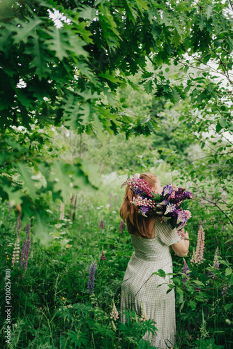 A young woman in a flowy dress and headband walks through a blooming daisy field, enjoying the peaceful countryside atmosphere under a cloudy sky.
