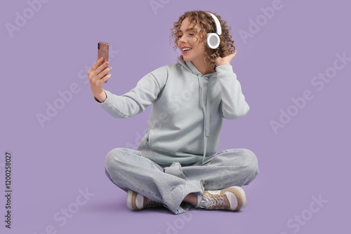 Young woman in headphones w...