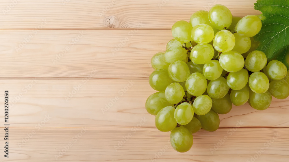 Fresh green grapes on wooden background with leaf Fresh green grapes on wooden background with leaf