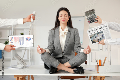 Young businesswoman with newspaper, calculator, telephone and charts meditati...
