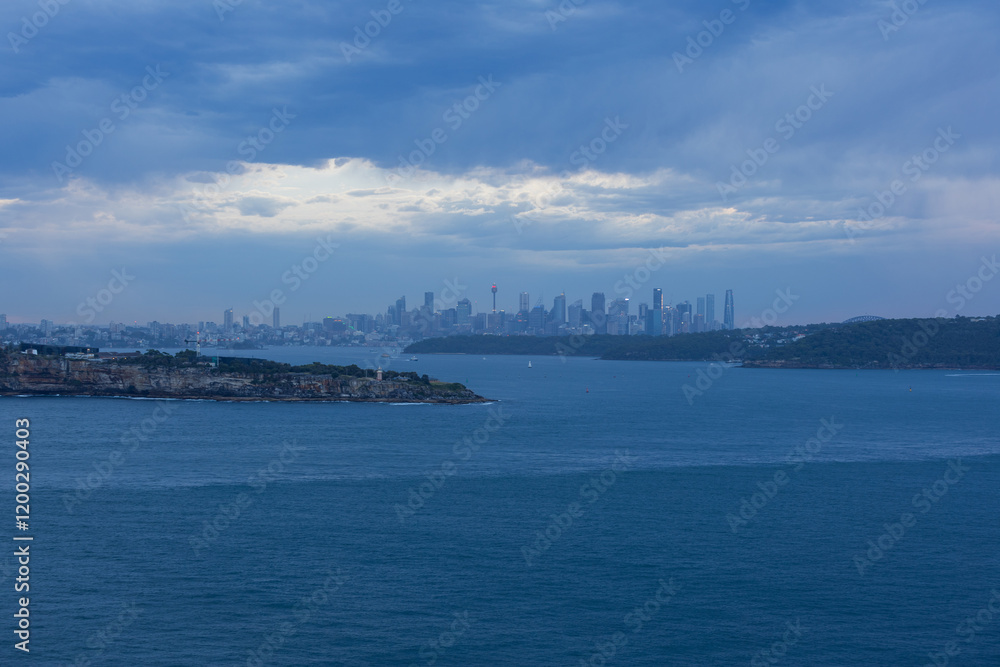 Cloudy view of Sydney skyline at sunset time. Cloudy view of Sydney skyline at sunset time.