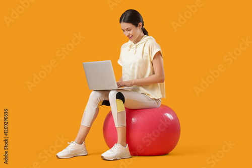 Sporty young woman with lap...