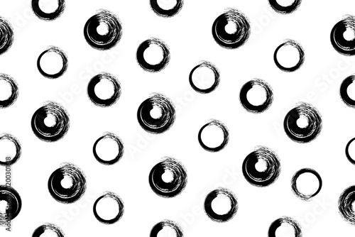 Seamless dotted pattern drawn with a bristle brush. Abstract background with handmade grunge elements.