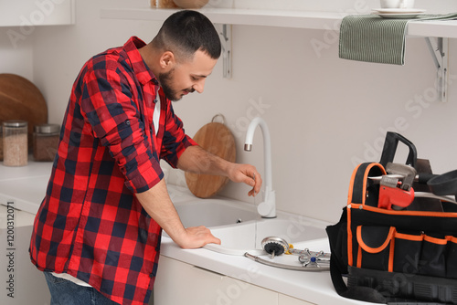 Male plumber with wire clea...