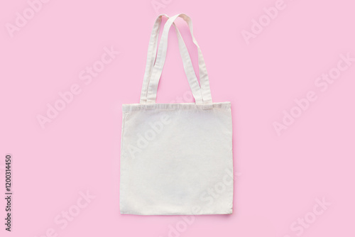 White cotton, canvas, tote, mesh bag on pastel pink background. Zero waste, no plastic, eco friendly shopping, recycling concept. Blank mockup shopper with place for artwork text. Flat lay, copy space photo