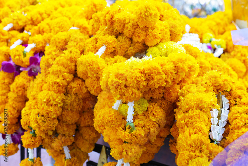 Marigold flowers for worship, Erawan shrine Bangkok city, Thailand photo