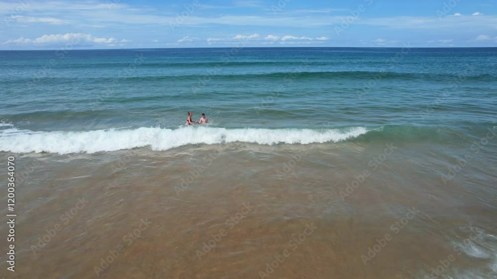 Tourists enjoying karon beach in phuket, thailand Tourists enjoying karon beach in phuket, thailand